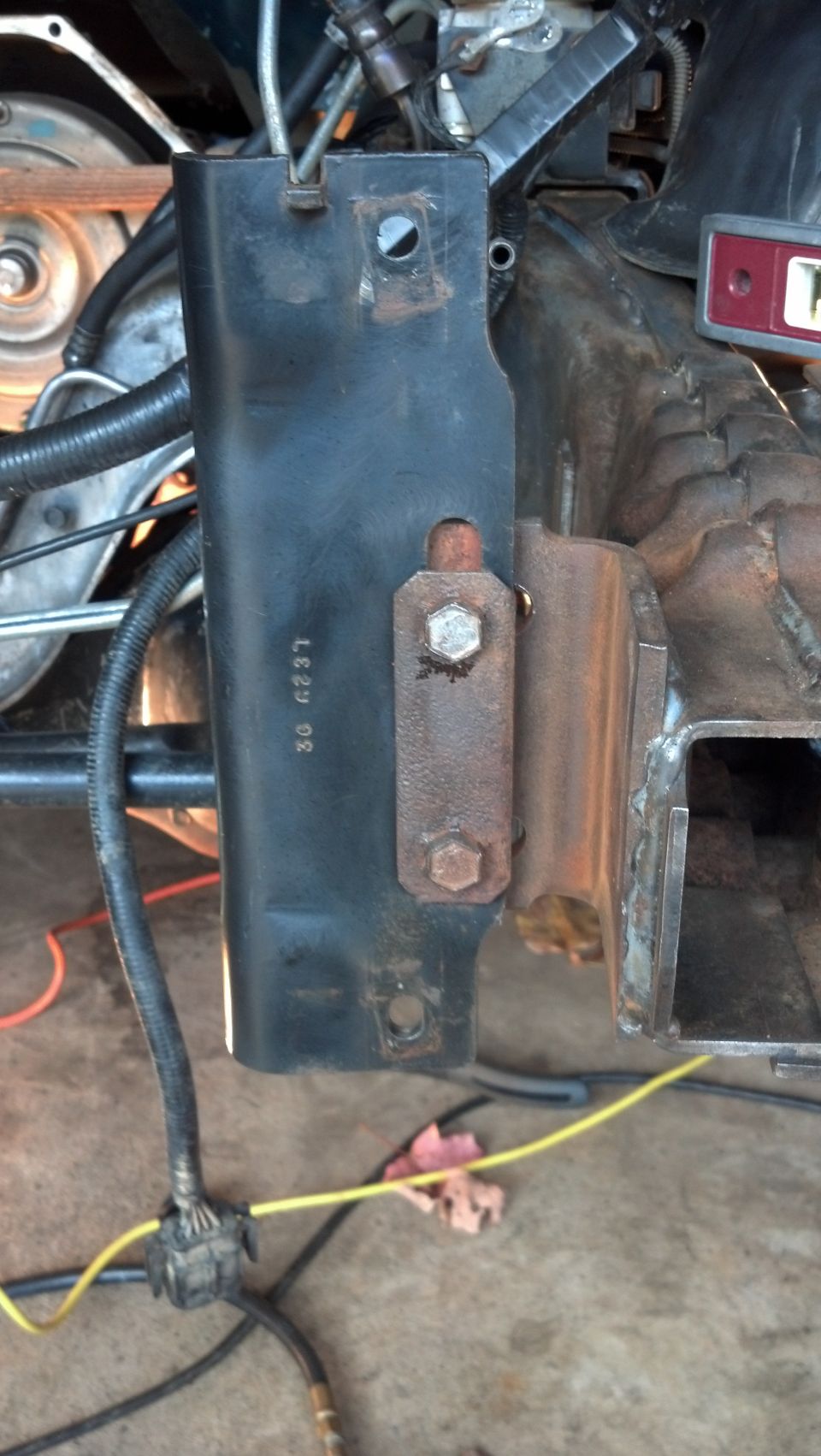 Black metal bracket with stamped numbers '30 6237'