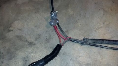 1993 Ford Bronco - Automotive wiring harness detail showing wire connections and protective conduit.