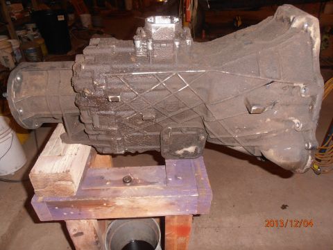 1996 Ford Bronco - A transmission part is shown in a workshop setting.