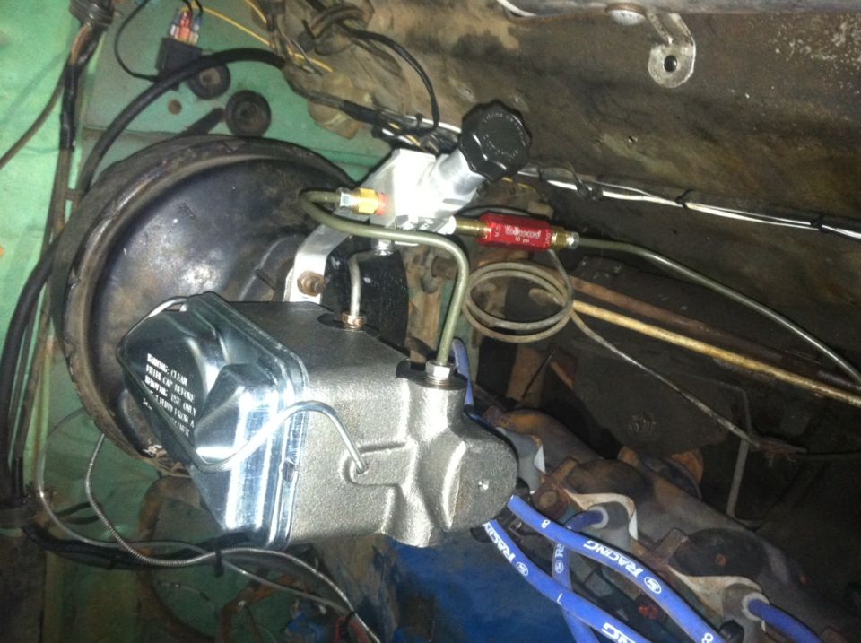 Brake master cylinder and booster assembly with brake lines