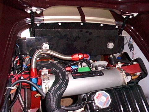 1967 Ford 427 - Close-up view of the engine bay, highlighting the accusump and associated plumbing.