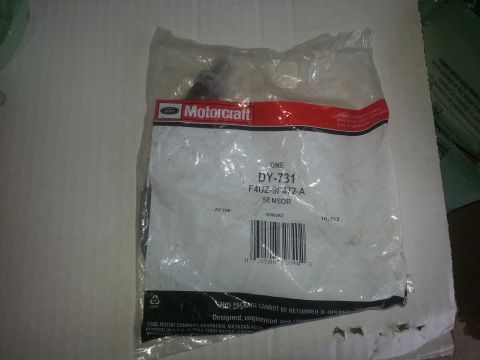 1994 Ford Bronco - A Motorcraft sensor part is shown in its original packaging, with part number DY-731 F4UZ-9F472-A visible.