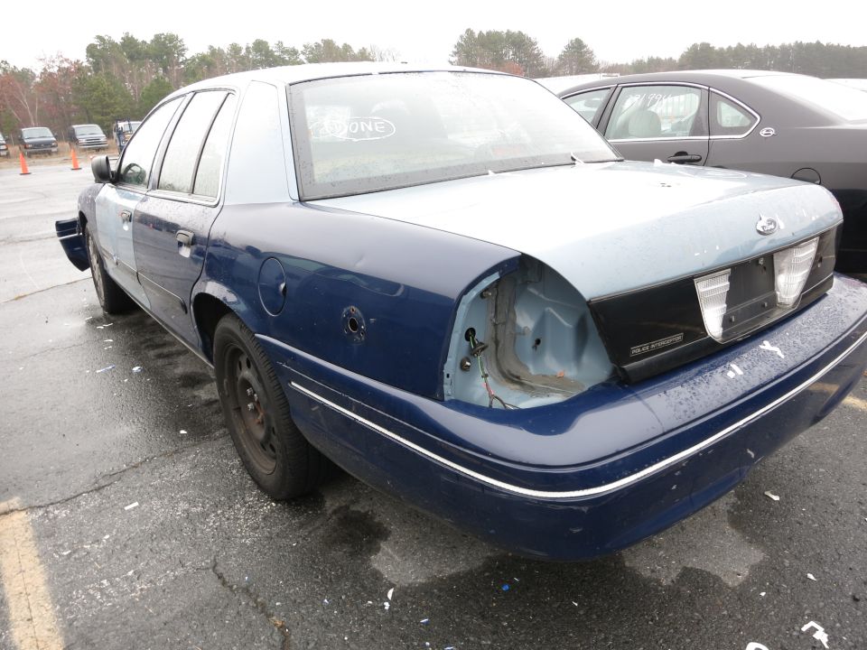 1991 Ford Crown Victoria with missing taillights and rear bumper damage