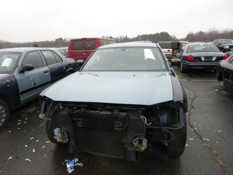1991 Ford LTD Crown Victoria - This car is missing its front bumper and grille, revealing the radiator and other internal components.