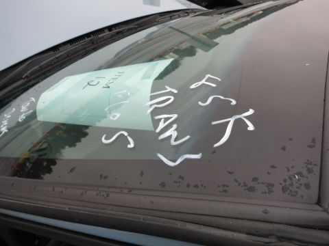 1991 Ford LTD Crown Victoria - White writing on a car windshield obscures any year-identifying details.