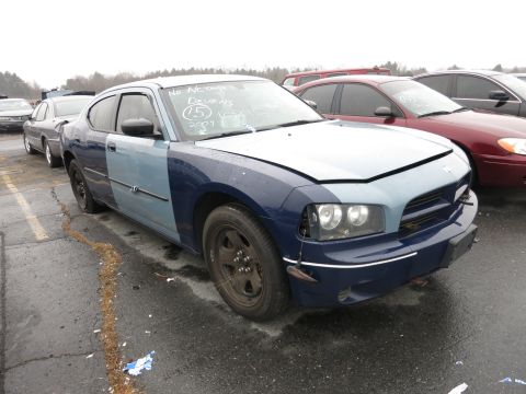 1991 Ford LTD Crown Victoria - A two-tone Dodge Charger sits in a parking lot, with handwritten notes on its windshield.