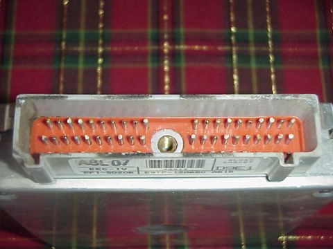 1989 Ford Bronco - This is an engine control unit with a prominent connector and visible part numbers.