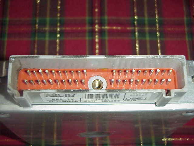 Close-up of an engine control unit's connector pins