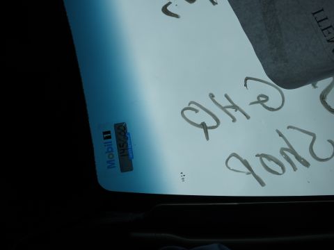 1991 Ford LTD Crown Victoria - Handwritten notes and a Mobil 1 sticker are visible on a vehicle's windshield.
