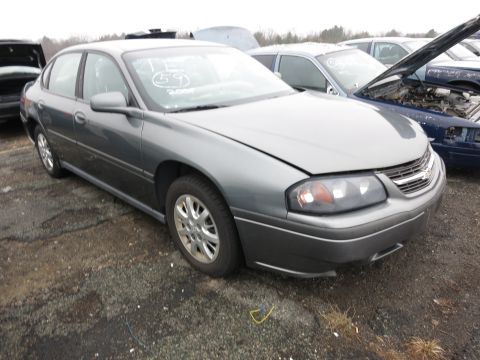 1991 Ford LTD Crown Victoria - This gray sedan appears to be from the early 2000s, not a 1991 Ford Crown Victoria LTD.
