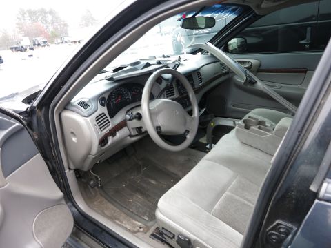 1991 Ford LTD Crown Victoria - Interior view of a car, showing the dashboard, steering wheel, and seats.