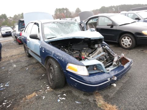 1991 Ford LTD Crown Victoria - This 1991 Ford Crown Victoria LTD has significant front-end damage and appears to be in a junkyard.