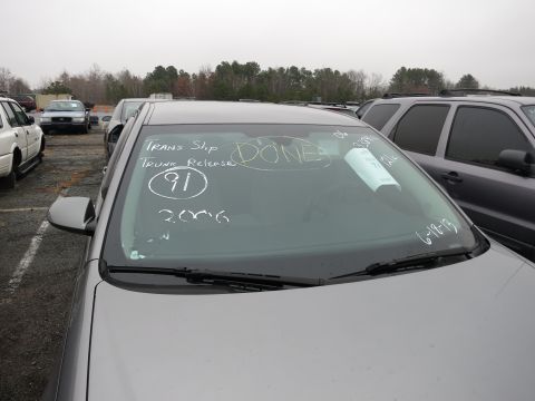 1991 Ford LTD Crown Victoria - Handwritten notes on a car's windshield include 'TRANS Slip', 'Trunk Release', '91', and 'DONE'.