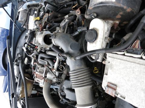 1991 Ford LTD Crown Victoria - Close-up view of a vehicle's engine bay, showing various components and wiring.
