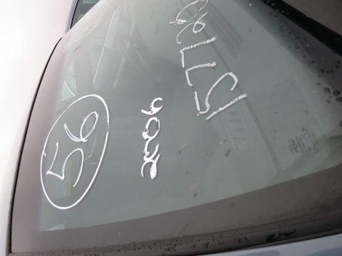 1991 Ford LTD Crown Victoria - Writing on the windshield includes '56' in a circle and '2006', with other illegible text.
