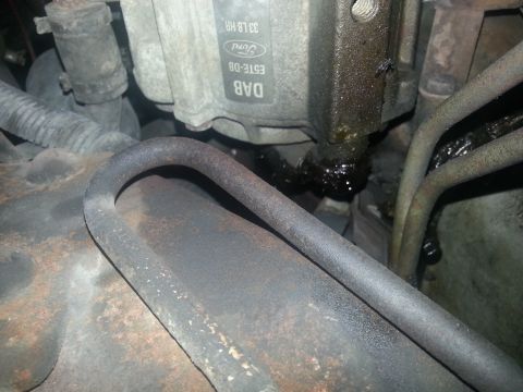 1994 Ford Bronco - Close-up of a Ford brake component showing an oil leak and visible Ford branding.