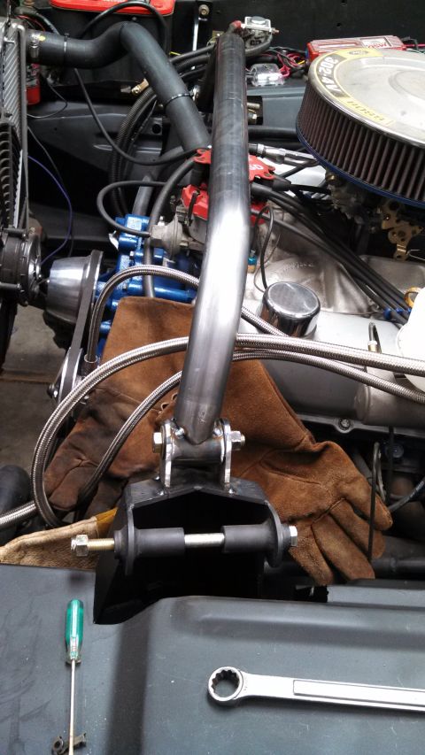 1967 Ford F-250 - Custom roll bar support installed in engine bay, with tools nearby.
