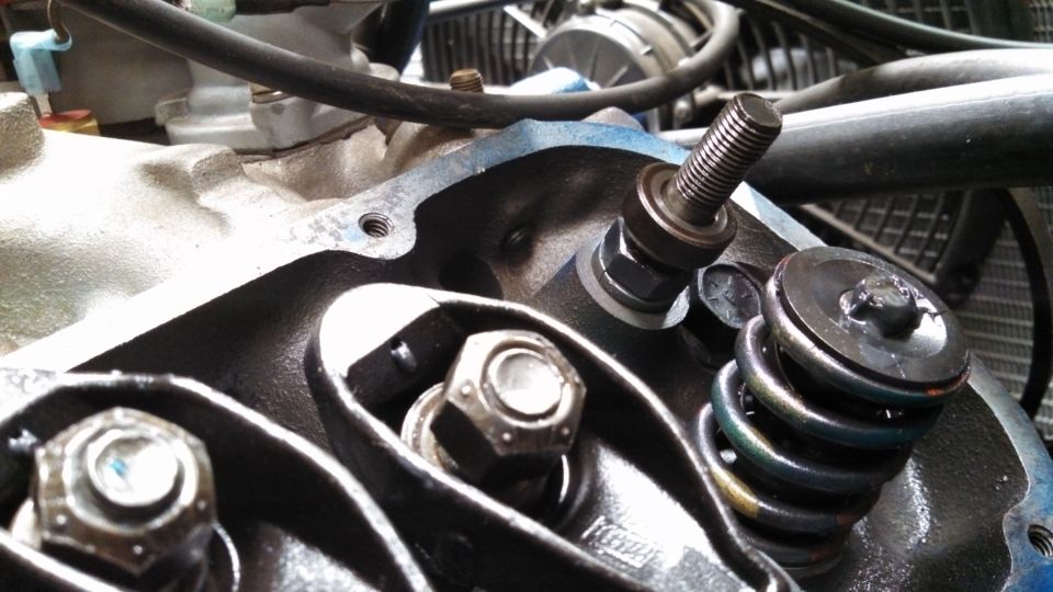 Close-up of engine valve train with rocker arms and springs