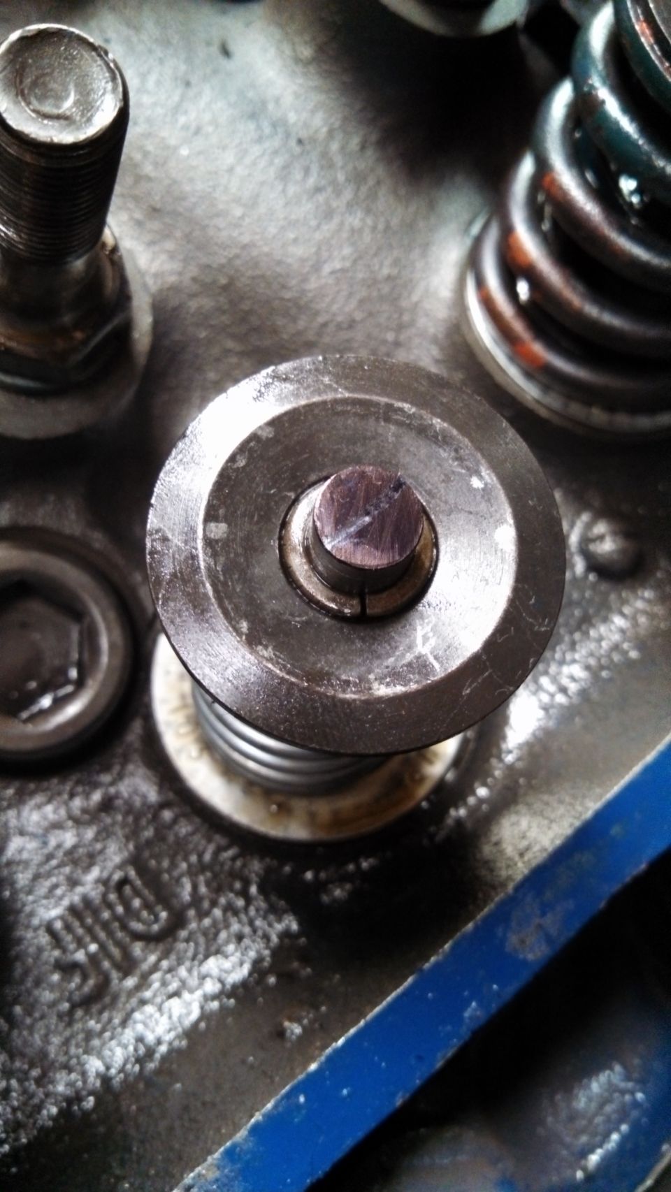 Close-up of valve spring retainer on engine block