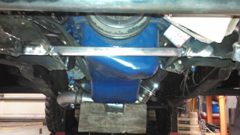 1967 Ford F-250 - Underside view shows the engine oil pan and exhaust system of a vehicle.