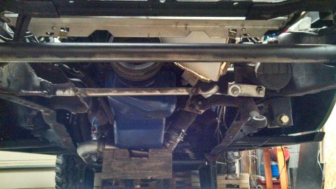 1967 Ford F-250 - Underside view of a truck's engine oil pan and suspension parts.