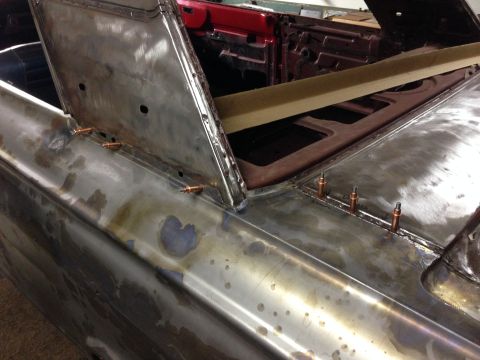 1964 Ford Fairlane - Bodywork in progress on a 1964 Ford Fairlane, revealing bare metal and repair details.