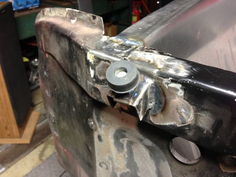 1964 Ford Fairlane - This is a close-up of a metal car part showing recent welding work and a rubber bumper.