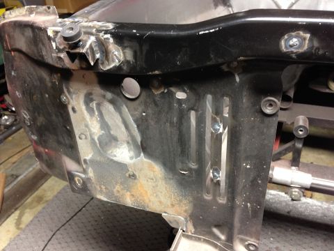 1964 Ford Fairlane - This image shows a section of a vehicle's frame being worked on, with evidence of welding and metal repair.