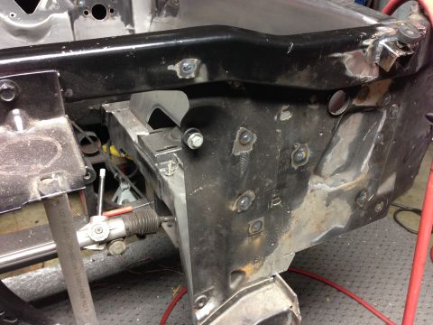 1964 Ford Fairlane - Close-up view of the front frame section of a 1964 Ford Fairlane undergoing restoration.