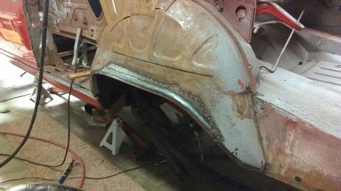 1964 Ford Fairlane - Welding is performed on the rear quarter panel of a 1964 Ford Fairlane during body repair.