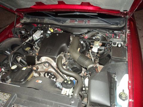 2004 Mercury Grand Marquis - Engine bay of a 2004 Mercury Grand Marquis, showing the V8 engine and associated components.