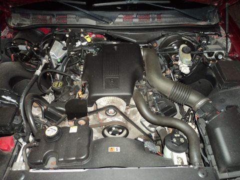 2004 Mercury Grand Marquis - The engine compartment of a 2004 Mercury Grand Marquis, its V8 engine and associated components.