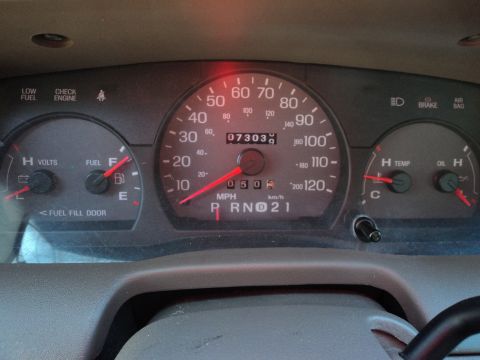 2004 Mercury Grand Marquis - The dashboard of a 2004 Mercury Grand Marquis displays mileage, fuel, and temperature readings.