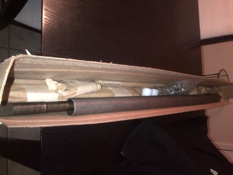 1985 Jeep CJ7 - A drive shaft is shown packed in a cardboard box with other parts.