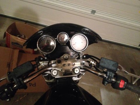 1998 Suzuki Bandit - Close-up view of motorcycle handlebars and instrument cluster.