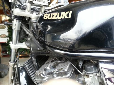 1998 Suzuki Bandit - A black Suzuki motorcycle is shown with its fuel tank and engine details visible.