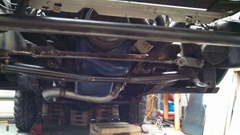 1967 Ford F-250 - Custom steering and exhaust modifications are visible on the undercarriage of this truck.