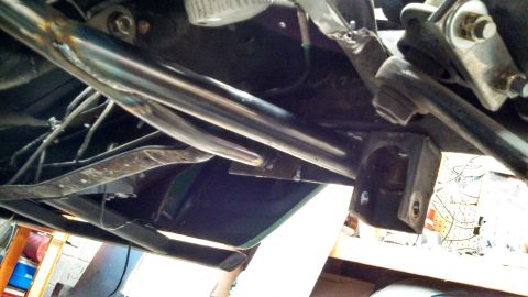 1967 Ford F-250 - Underside view of a vehicle's chassis, revealing various mechanical parts and wiring.