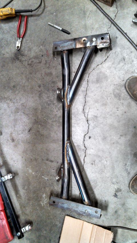 1967 Ford F-250 - A custom-fabricated metal frame, likely for a vehicle modification or build project, is shown on a concrete floor.