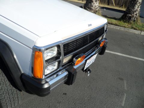 1994 Jeep Cherokee - Front view of a 1994 Jeep Cherokee, showing the grille and headlights.