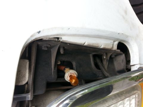 1992 Ford Bronco - you can see the alignment pins for the fender behind the headlamp bezel.