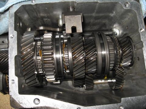 1966 Ford Falcon - Close-up of internal transmission gears and components within a metal casing.