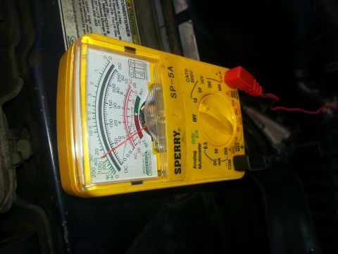 1994 Ford Bronco - A yellow Sperry analog multimeter is used to diagnose engine problems in a vehicle.