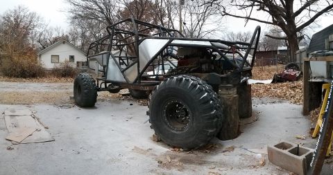 1986 Ford Bronco - This custom-built buggy, likely a project in progress, features a robust roll cage and oversized tires.