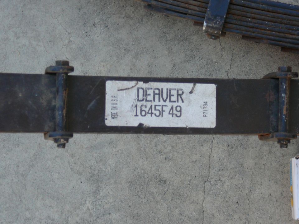 Leaf spring with a label reading DEAVER 1645F49 and MADE IN U.S.A