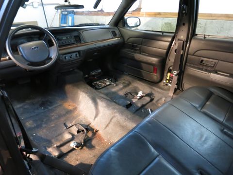 1991 Ford LTD Crown Victoria - Photograph of a partially stripped car interior, not a document.
