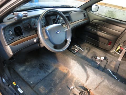1991 Ford LTD Crown Victoria - Photograph of a car dashboard and interior during teardown, not a document.