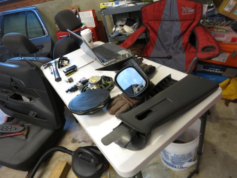1991 Ford LTD Crown Victoria - Photograph of removed parts laid out on a workbench, not a technical document.