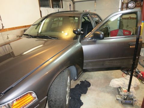 1991 Ford LTD Crown Victoria - Photograph of a Crown Victoria in a garage, not a technical document.