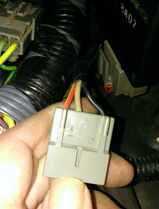 Connector on right side of steering column, near ign switch for the Inferred Mileage Sensor (IMS), which is non-existent for '88 5.0L Broncos.
